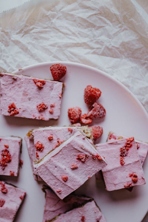 Slices of Cakes with Raspberries on Top