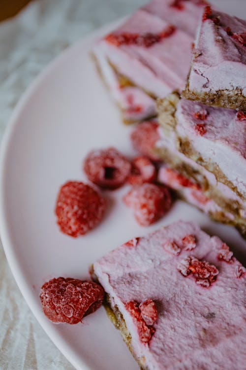 Sliced Cakes with Raspberries on Top