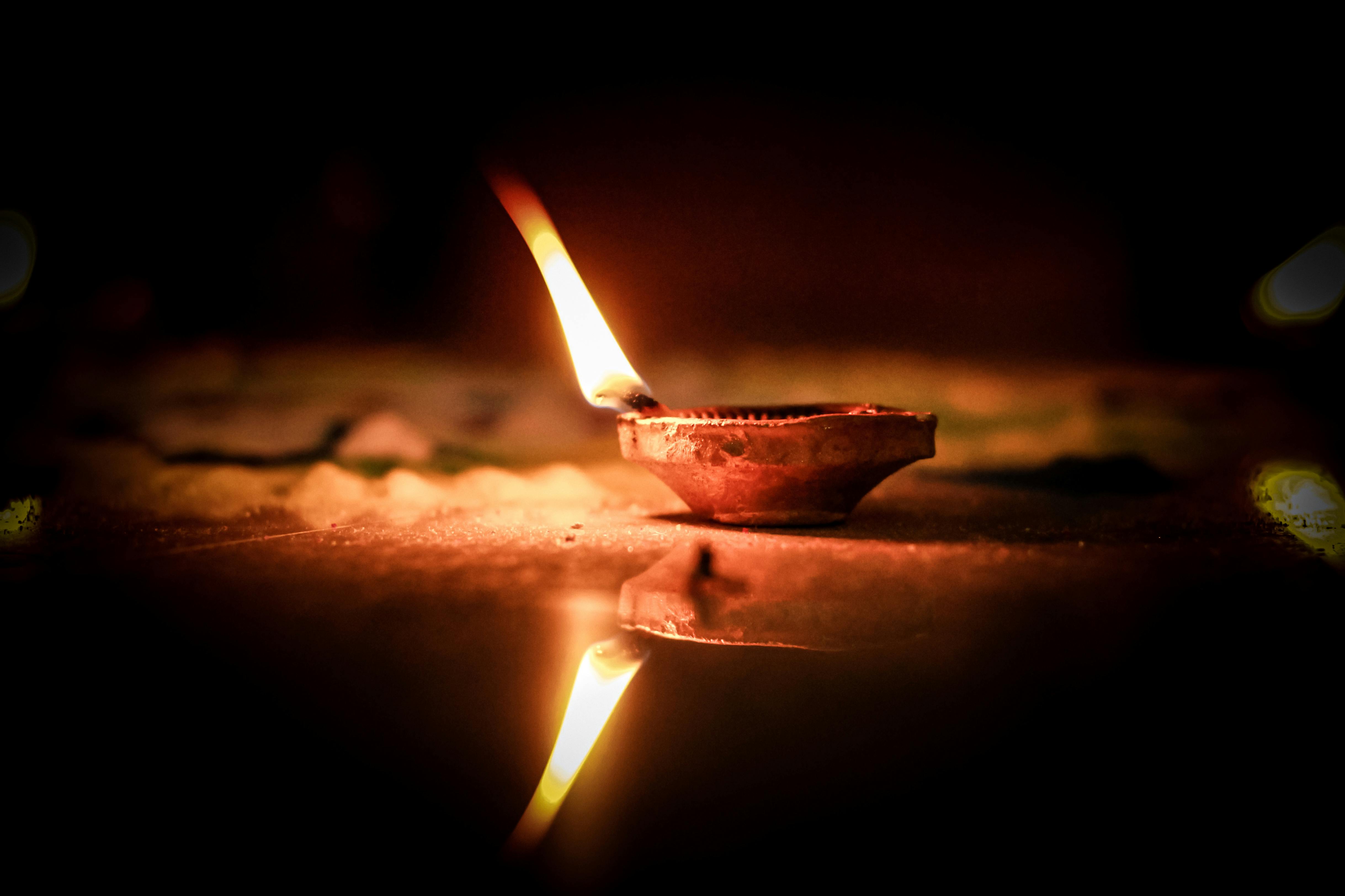 Close Up Shot of a Lighted Candle · Free Stock Photo