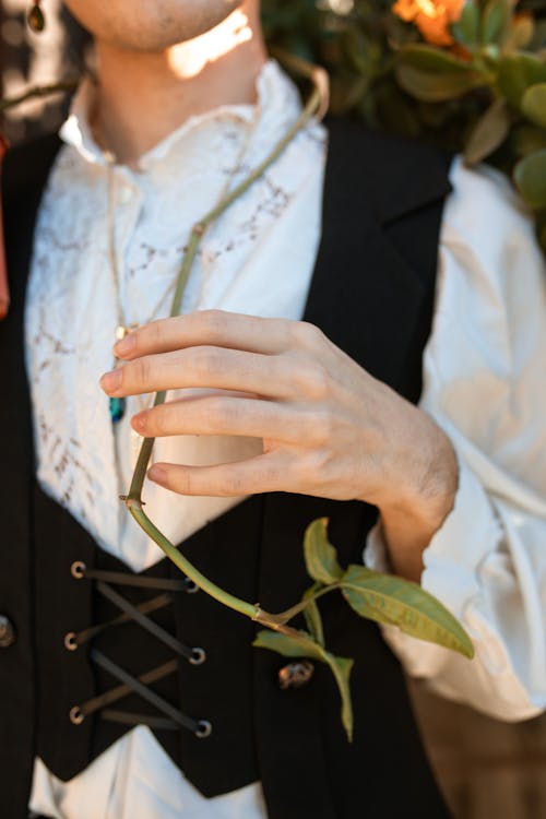 A Person Holding a Green Stem