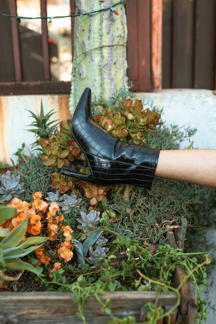 Person Wearing Black Leather Boots