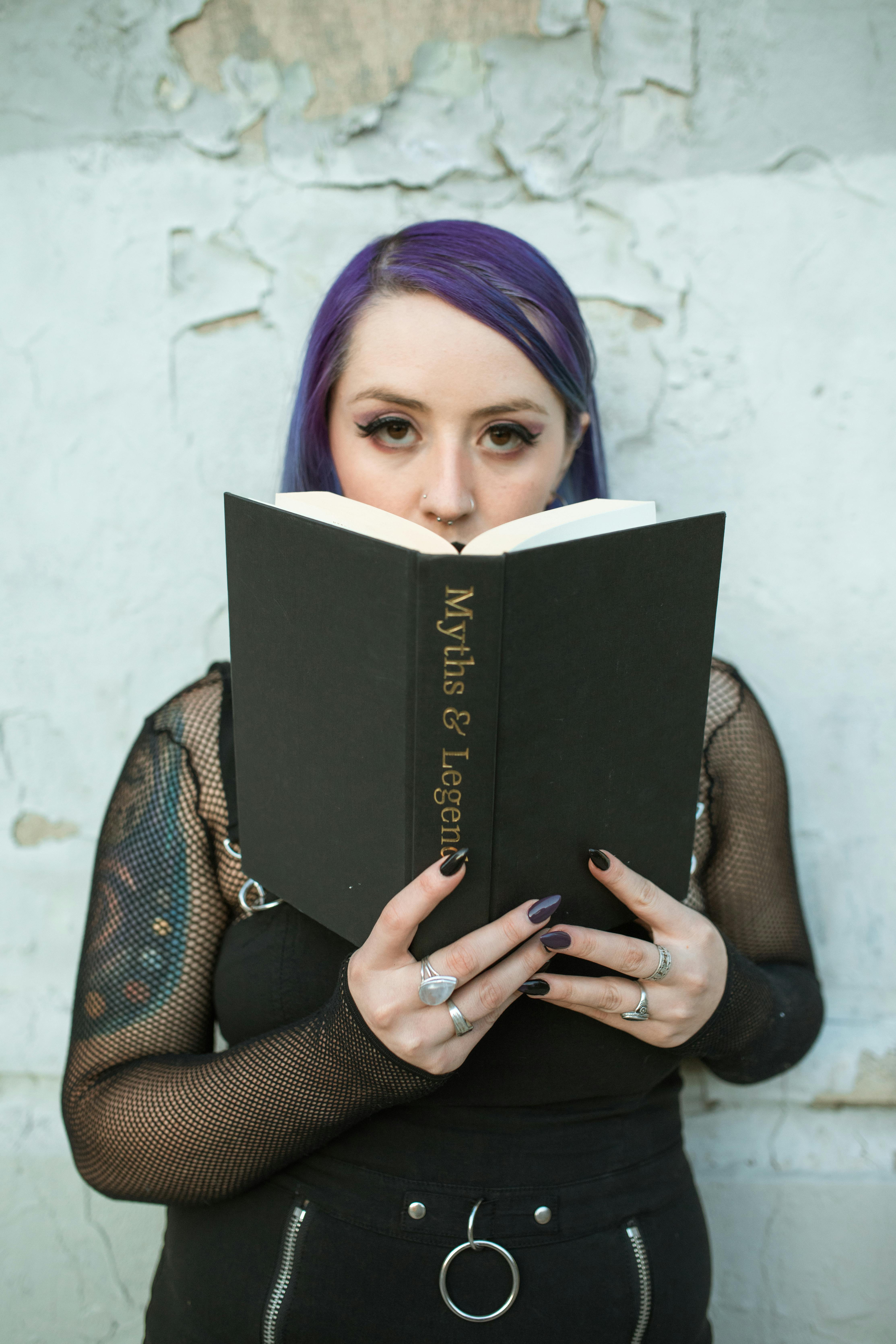 close up shot of a woman holding a book