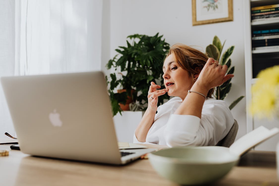 Free Woman Working From Home on Laptop Stock Photo