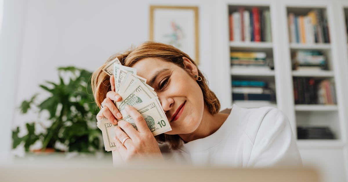 Happy woman with dollar bills, symbolizing financial success and fulfillment.