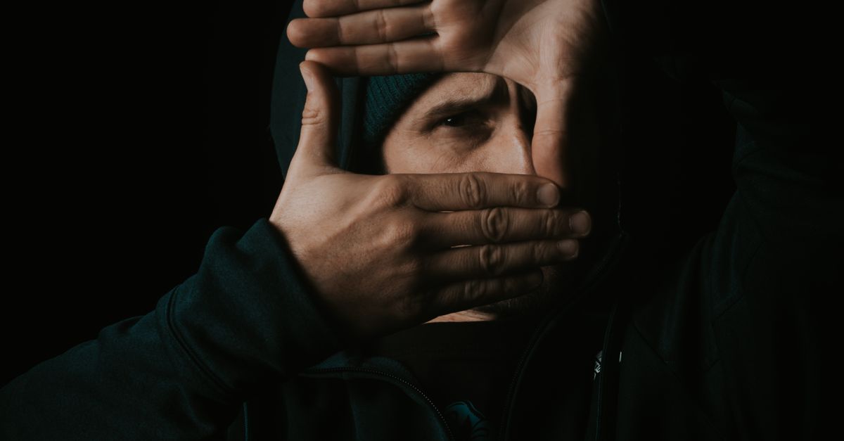 Face Less Frame Faceless guy making frame gesture in dark studio · Free Stock Photo