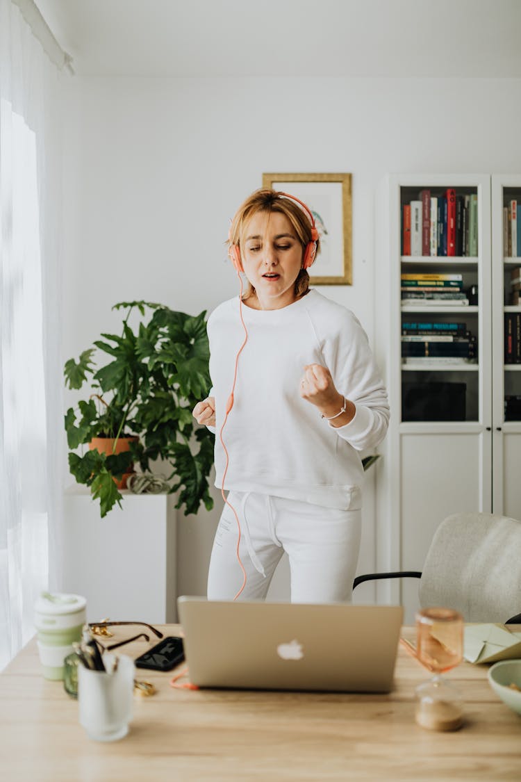 Woman Listening To Music From A Laptop 