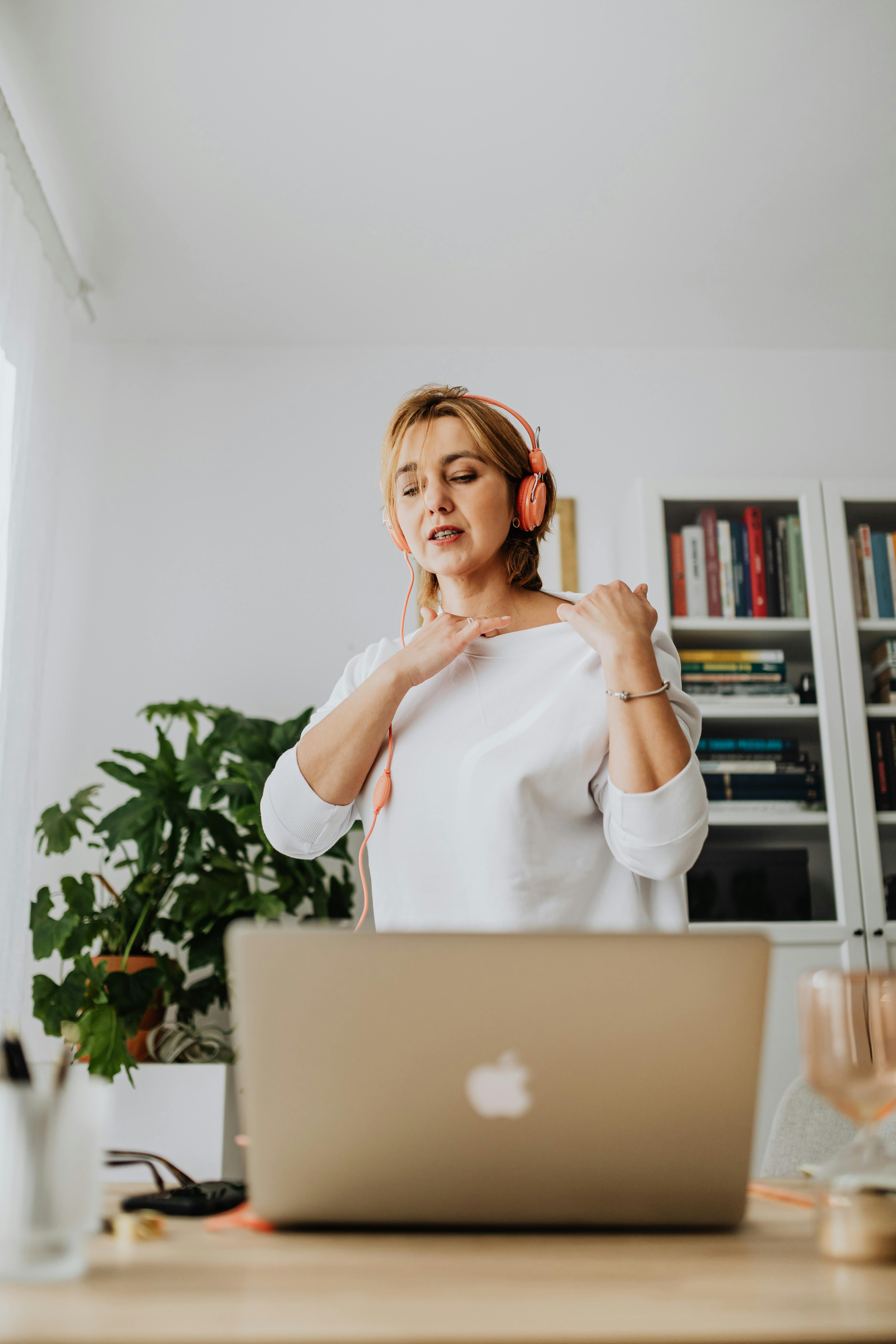 woman talking on video call with headphones on