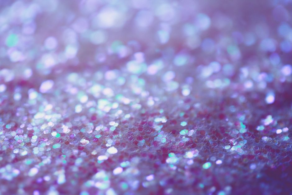 A close-up of shimmering purple bokeh lights creating a dreamy, magical atmosphere.