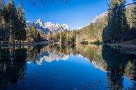 Green Trees Near Lake Under Blue Sky