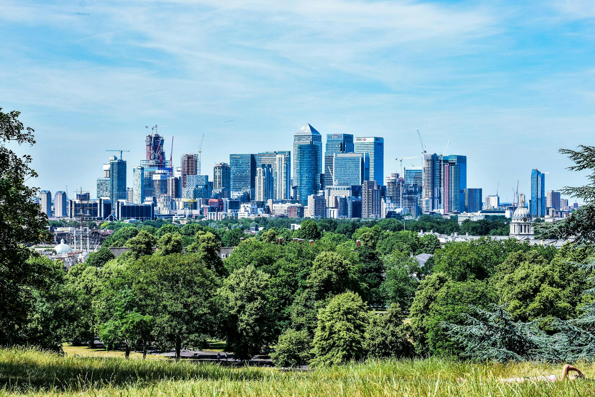 Stunning view of London skyline with greenery from Greenwich Park.