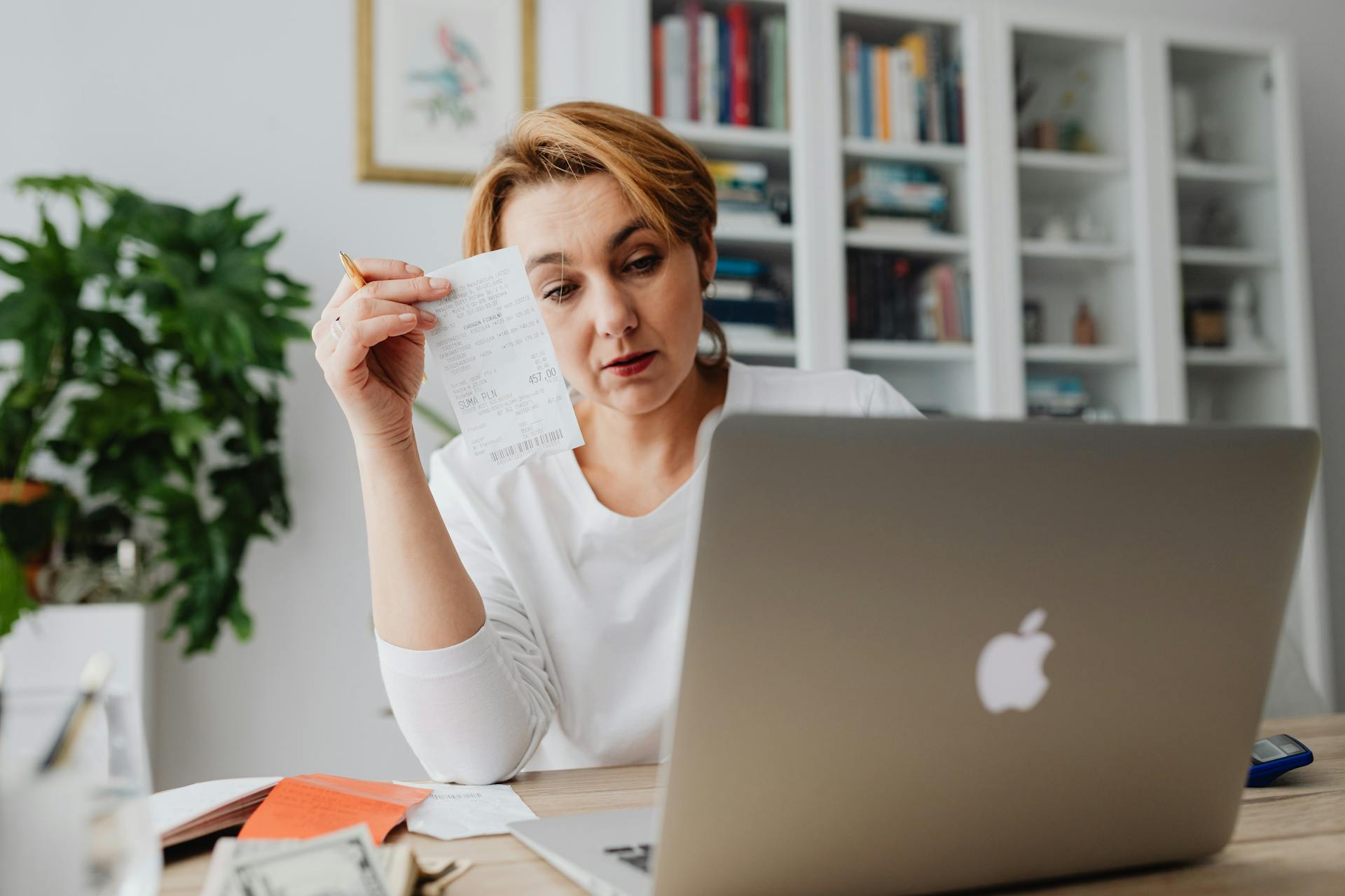 Woman Calculating Her Receipts