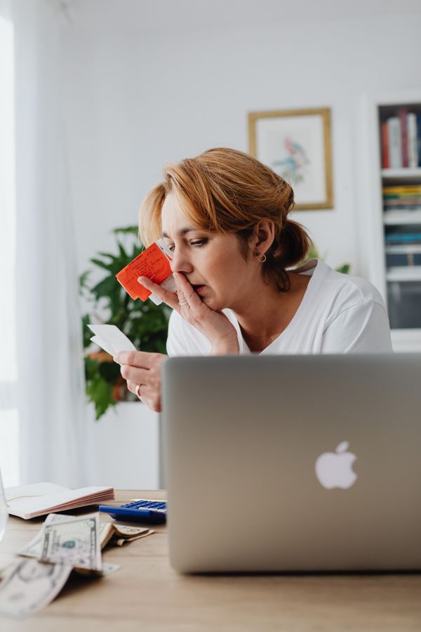 A shopper reviewing receipts and card spending