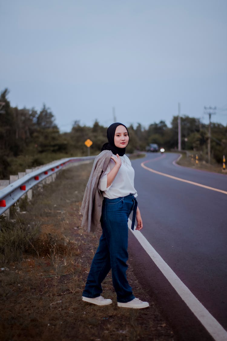 Hijabi Woman Crossing Street At Night