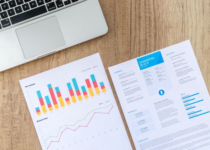 Printed performance reports on a desk