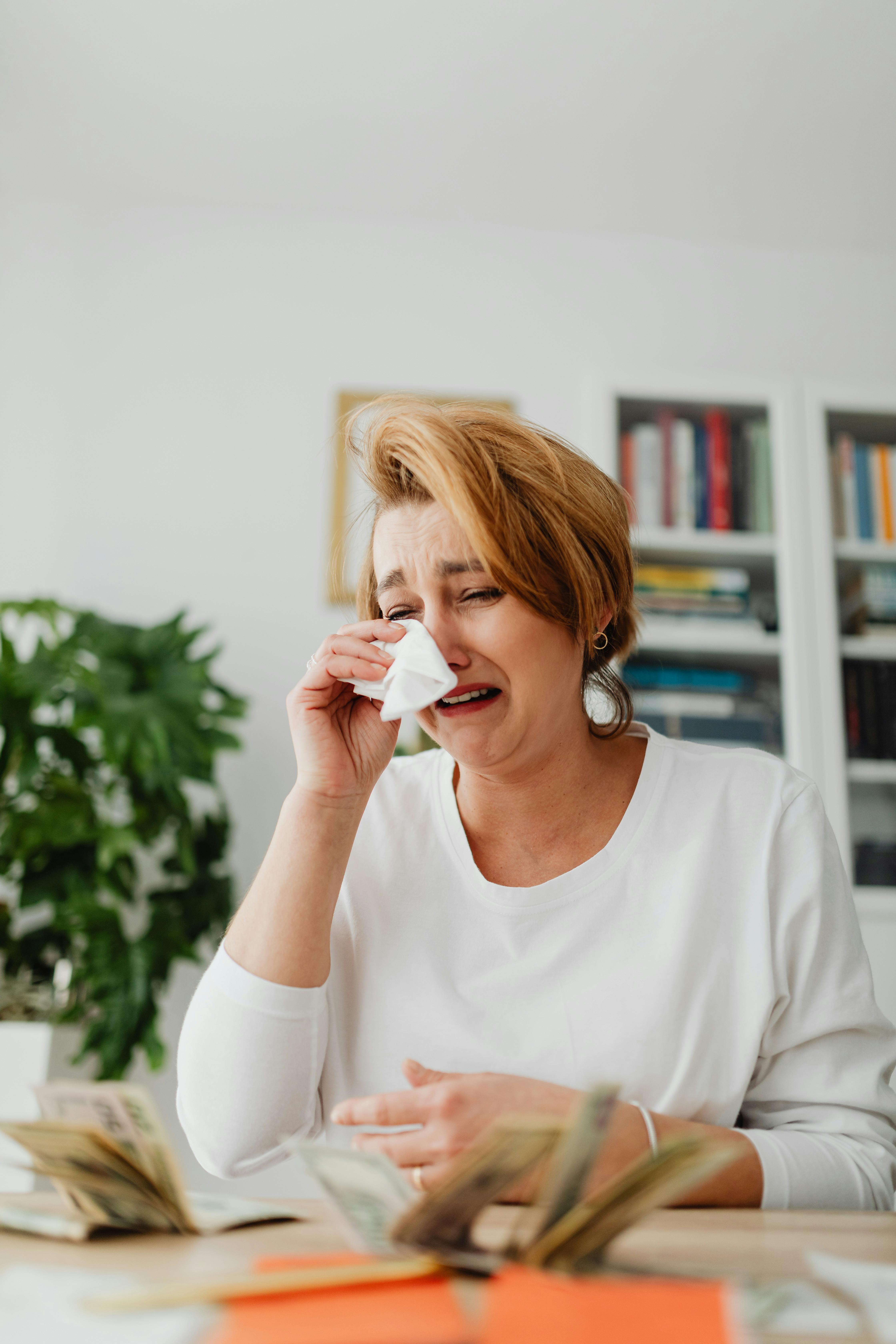 woman crying over money