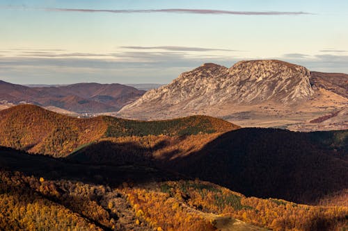 An Aerial Photography of Mountains Under the Blue Sky