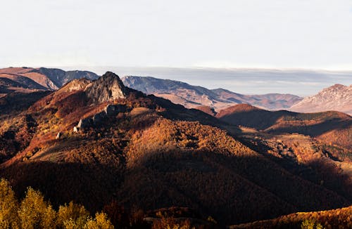 Brown Mountains Under Clear White Sky