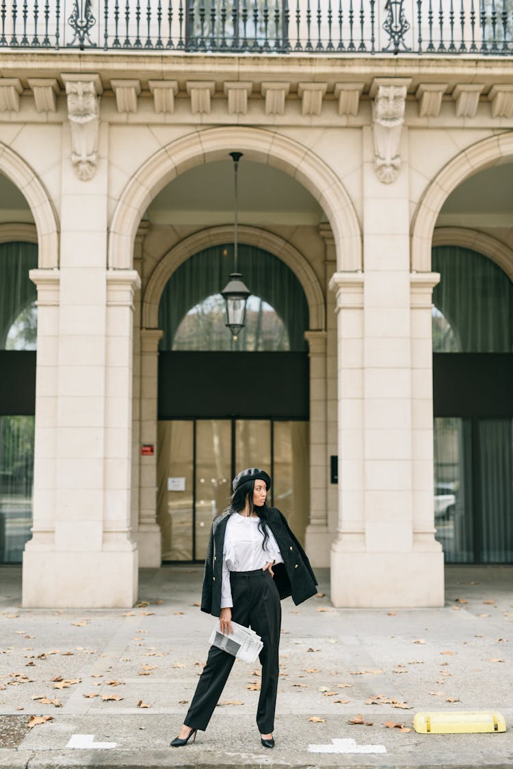 A Woman In Black Blazer Standing On The Street