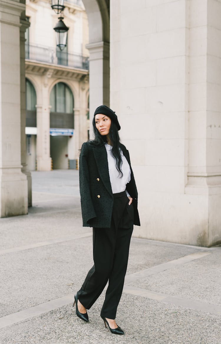 A Woman In Black Blazer Standing On The Street