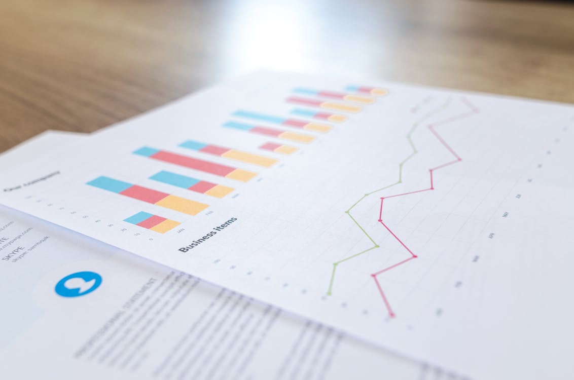 Paper with Graph and Line Chart, representing the importance of technical documentation writers.