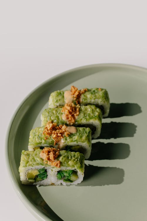 Sushi with Wasabi on Green Ceramic Plate 