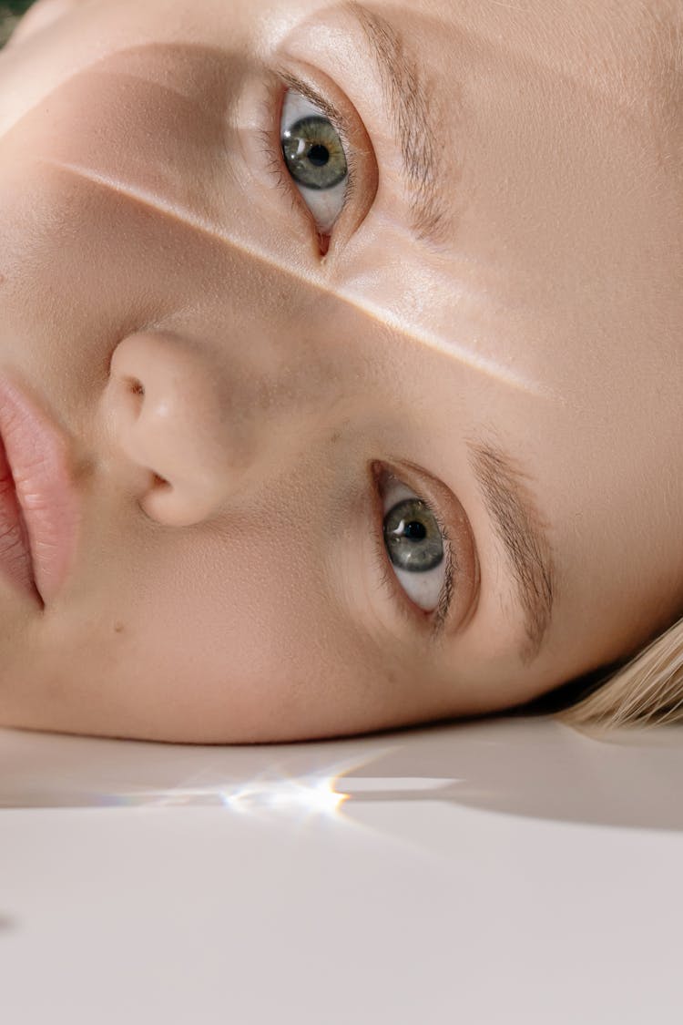 Woman's Face In Close Up Photography