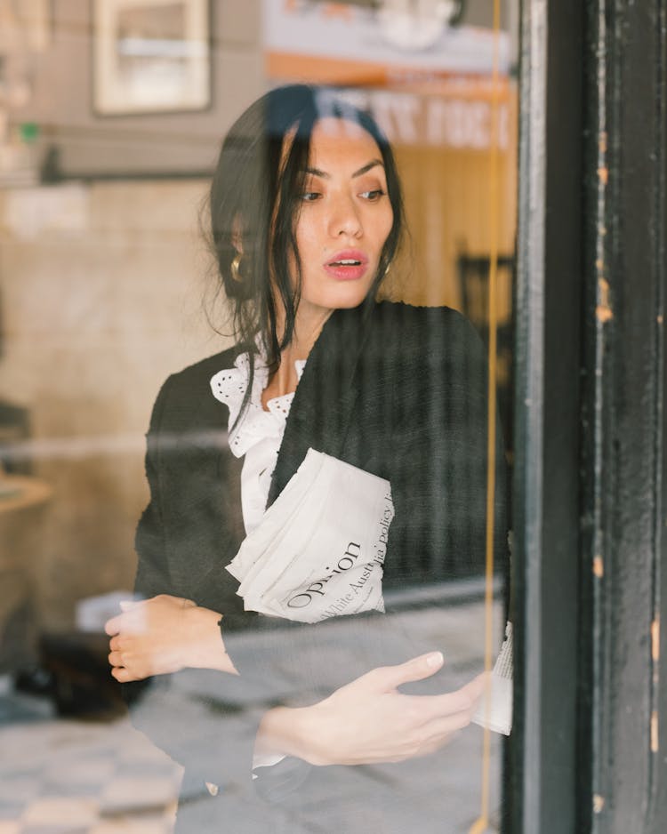 A Woman Behind Glass