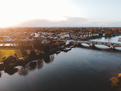 River flowing in peaceful city in sunlight