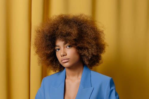 An Afro-Haired Woman in Blue Blazer 