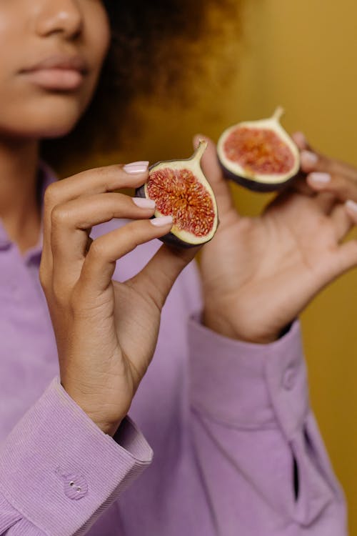 Person Holding Sliced of Watermelon