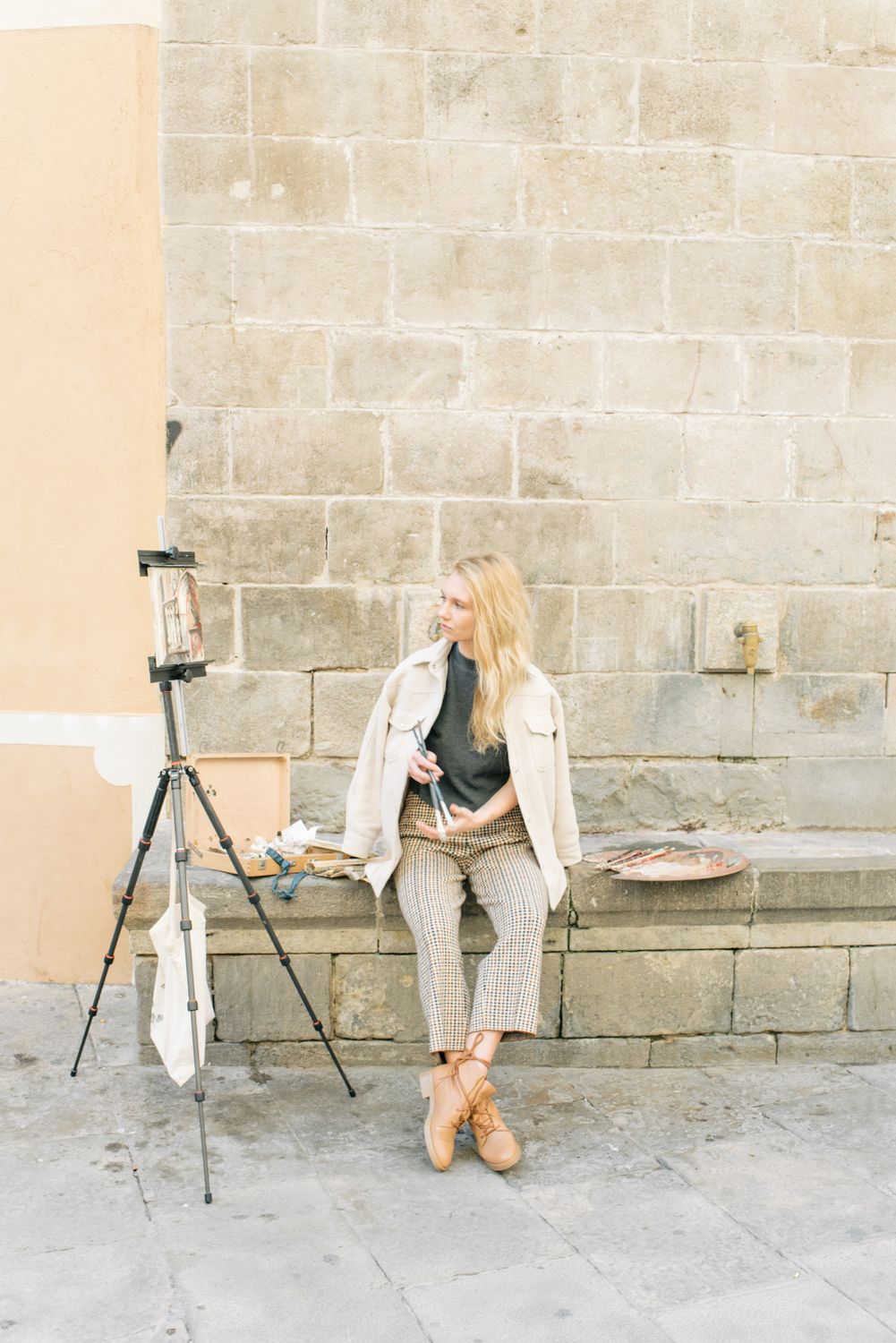 A Woman Sitting on the Concrete Bench · Free Stock Photo