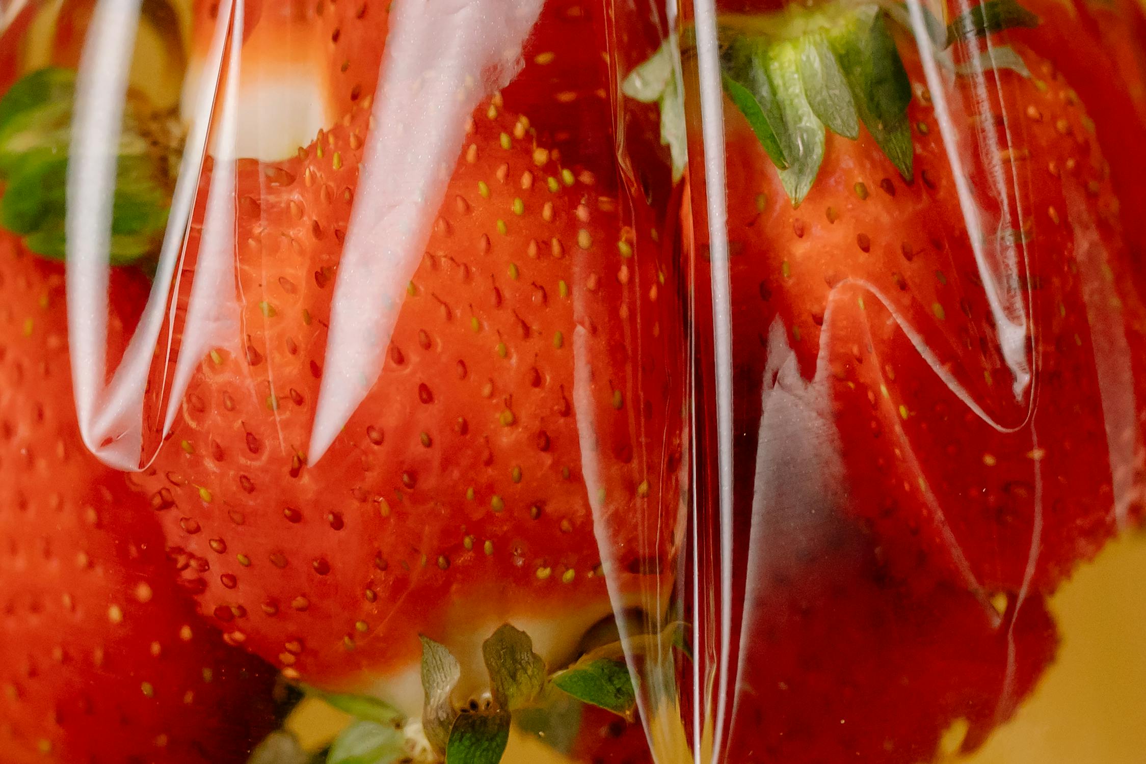 plastic wrap on strawberries