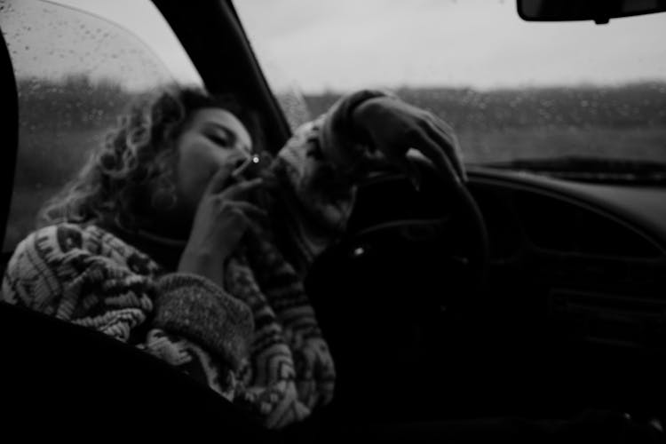 Sad Woman Smoking In Car