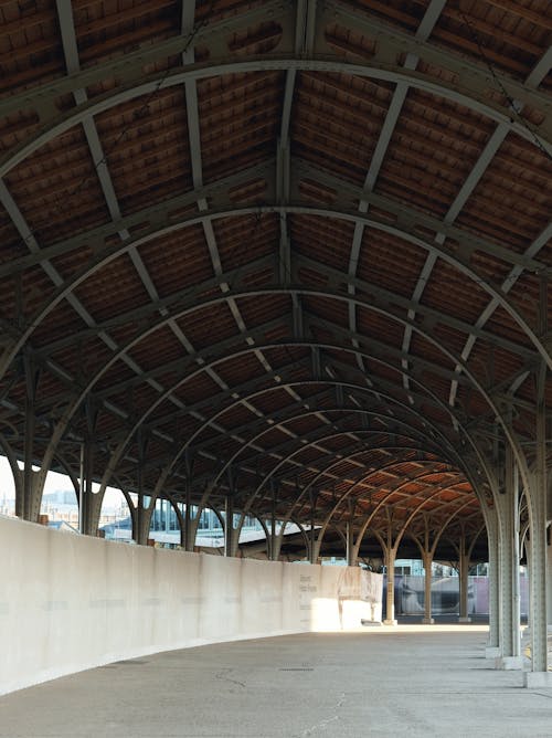 Free Complex Metal and Wood Arcade Roof and Concrete Floor Stock Photo