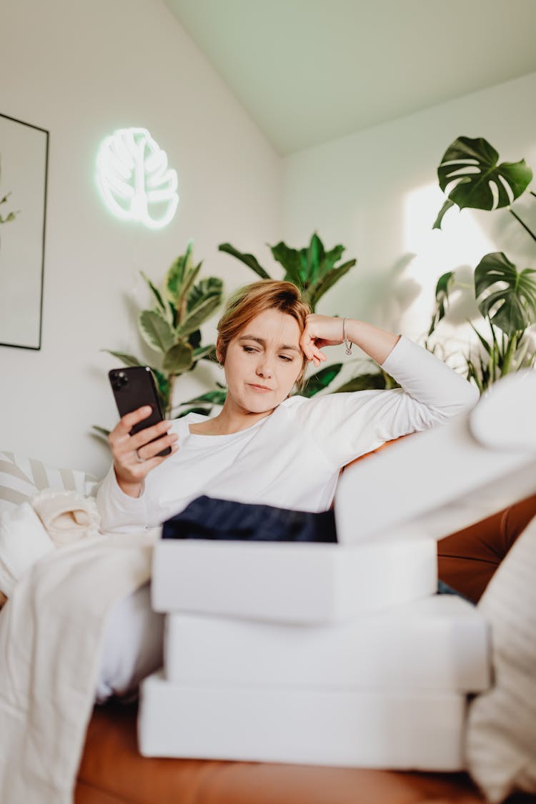 Woman Shopping For Clothes Online