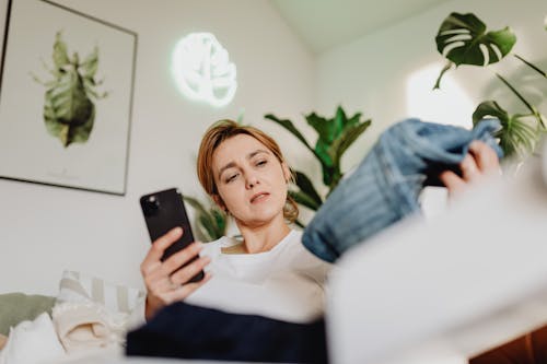 Woman Using Phone for Online Shopping