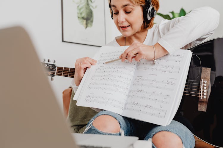 Woman Teaching Music Through Video Call