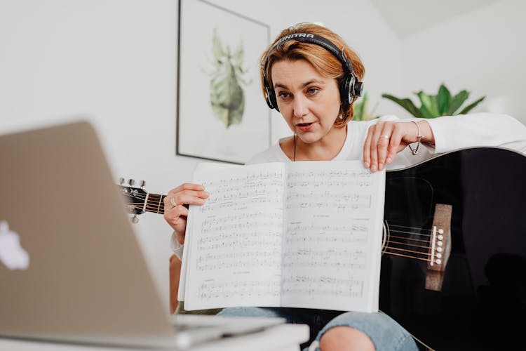 Woman Teaching Music Online On Computer