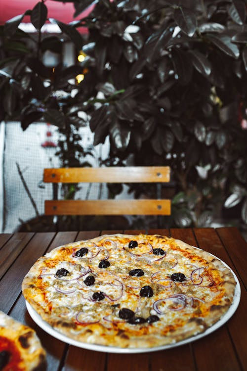 A Pizza on a Wooden Table