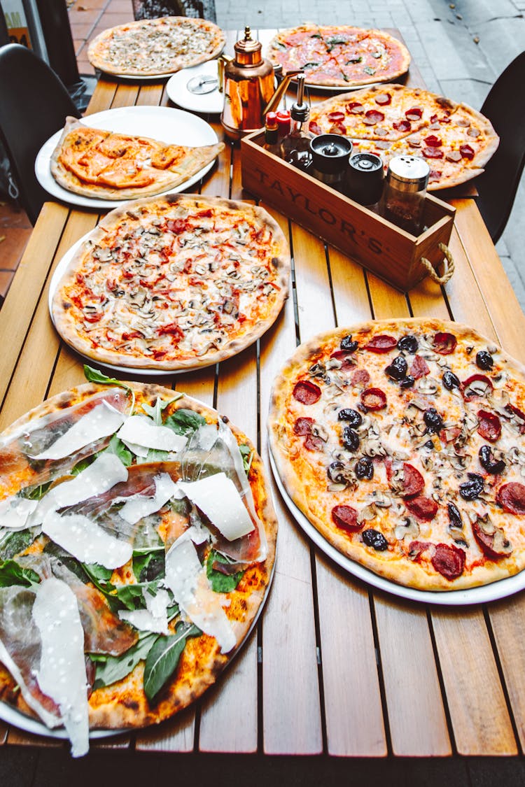 Pizzas On A Table