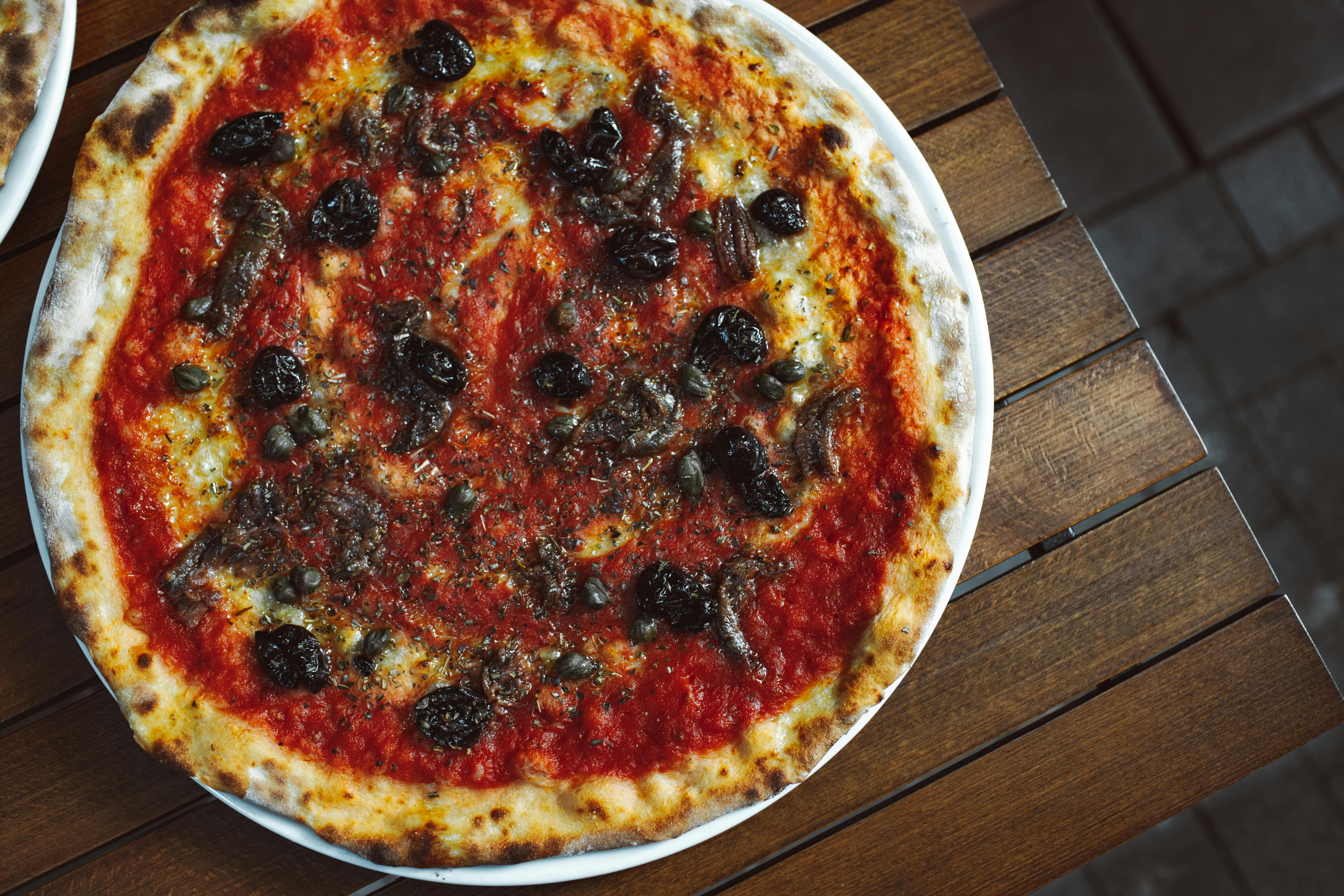 Spicy Arrabbiata pizza with fire-roasted tomato sauce and chili flakes