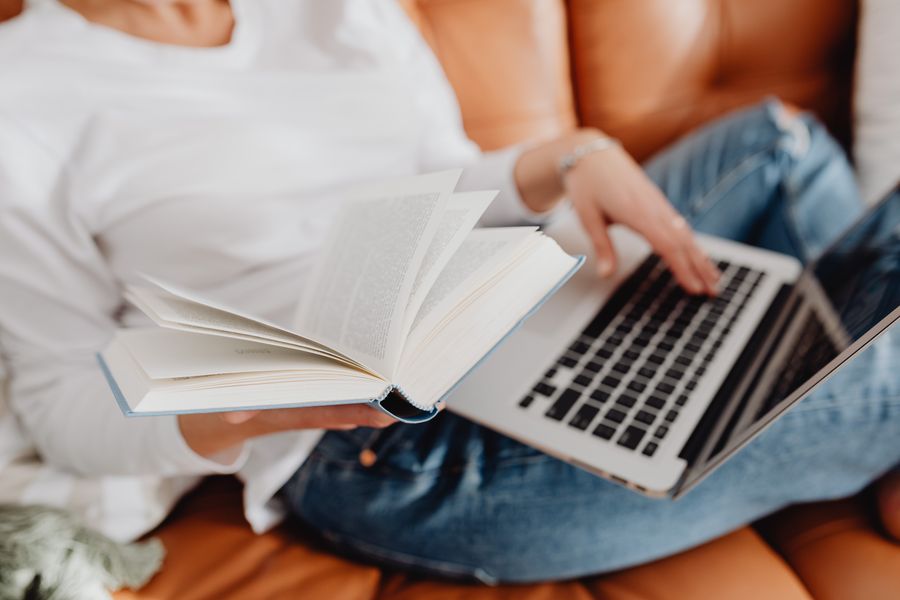 Reading a marketing guide at home — photo by Kaboompics on Pexels