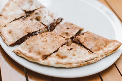 Free A Crepe with Chocolate Filling on White Ceramic Plate Stock Photo