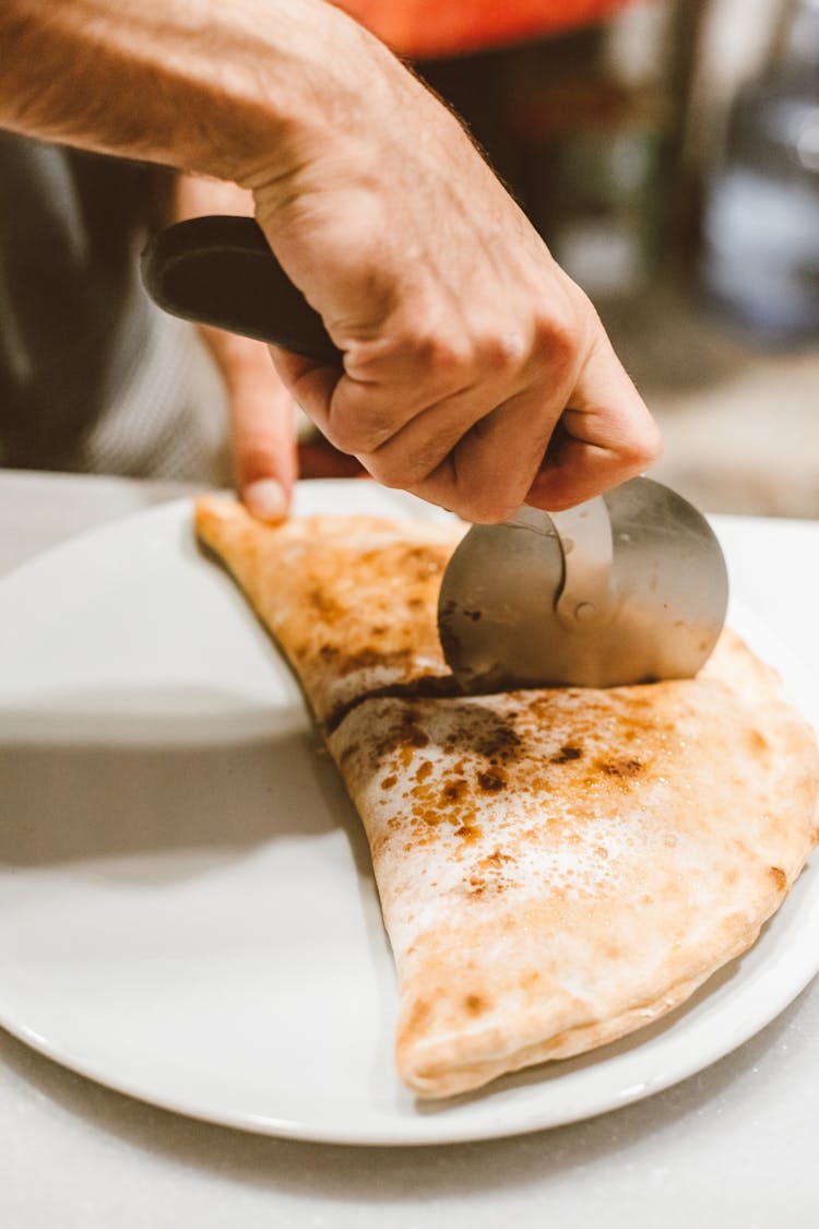 Person Cutting A Pie