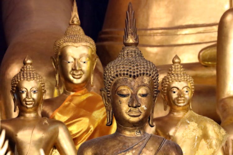 Gold Buddha Statues In Close-up Photography