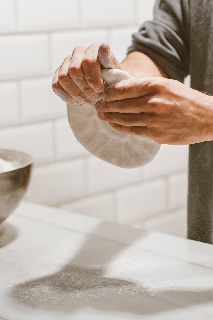 Hands Kneading A Dough