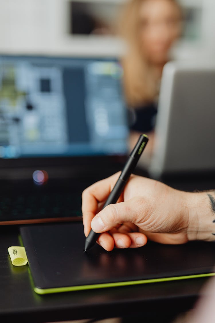 Person Holding Black Stylus Pen