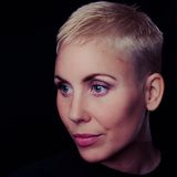 Close-up portrait against a plain wall — Janko Ferlic on Pexels