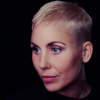 Portrait of a woman with short hair — photo by Janko Ferlic on Pexels