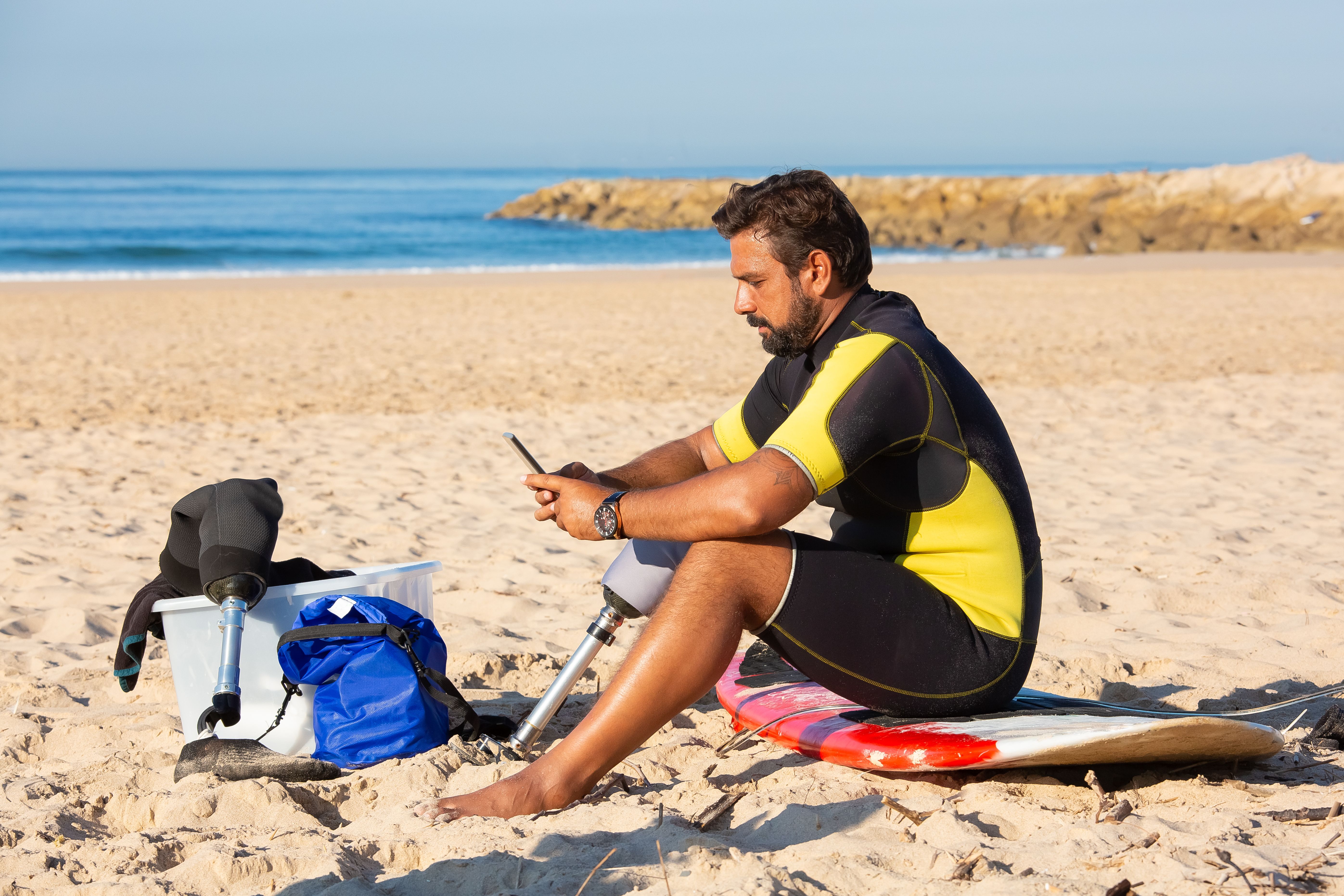 Surfing Rider Young male surf rider surfing on board and using smartphone · Free ...